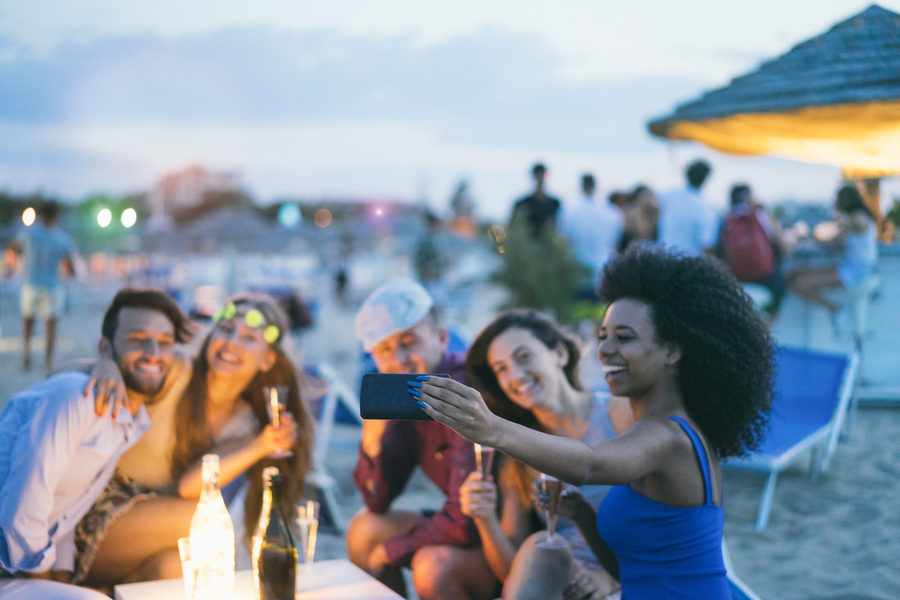 friends taking a selfie on the beach in miami