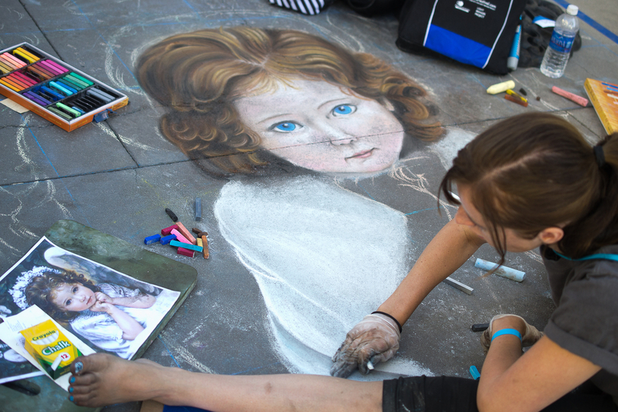 Painting Art Mural with chalk on street at the Pasadena Chalk Festival