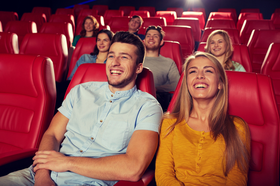 people sitting at a theatre watching a stand up show in clifornia 